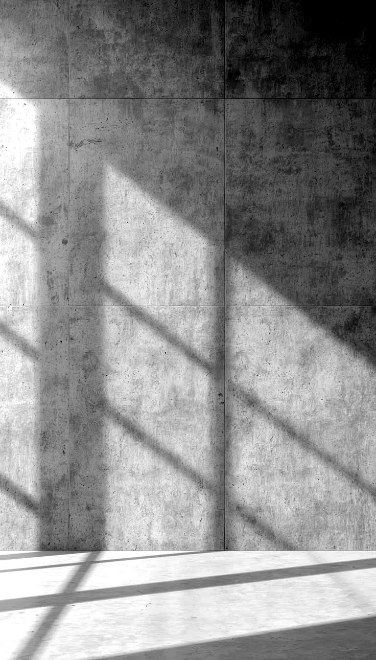 Pared de concreto con la sombra de una ventana.